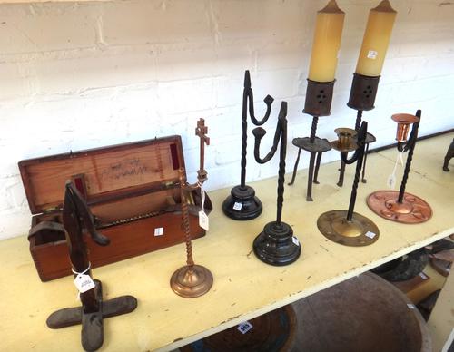 An Arts and Crafts style copper and wrought iron rush light candlestick, stamped 'Youghal' to the base, 25cm high, two brass rush lights with crucifix