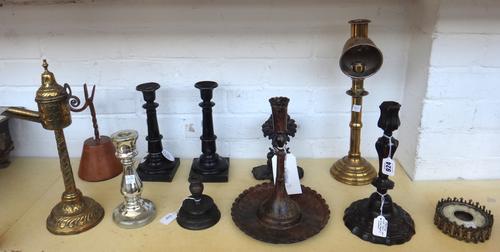 An 18th century French bronze candlestick, of foliate tapering form 26cm high, a mid-19th century Italian bronze candlestick 10cm high, a pair of 19th