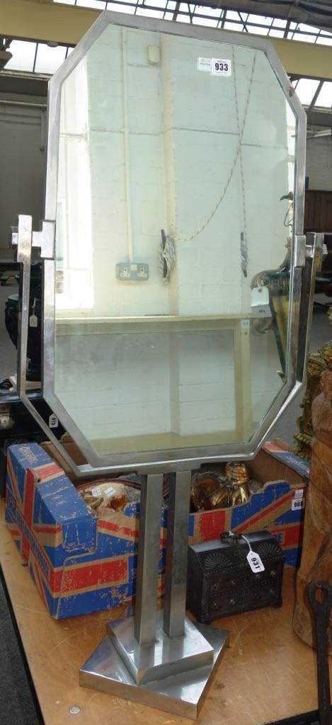 An Art Deco chromed metal swing frame table mirror, circa 1930, of double sided canted rectangular form, on a stepped square base, 95cm high.