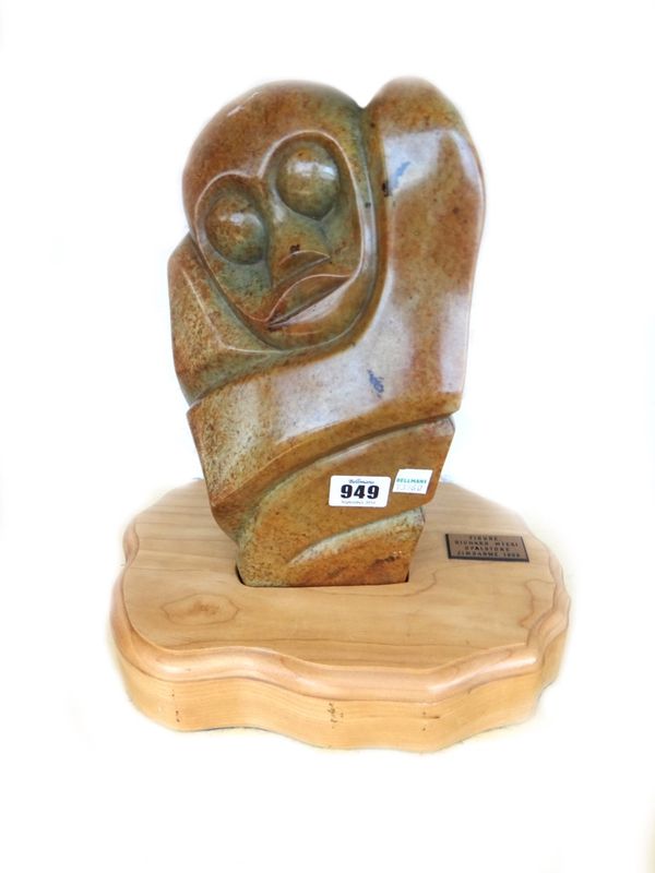 Richard Mteki; a carved opalstone figure raised on a shaped wooden plinth, Zimbabwe 1998, the figure 30cm high.