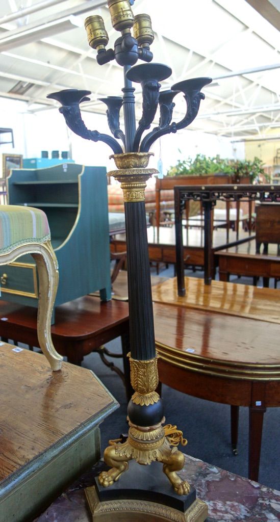 A pair of bronze Empire style six branch candelabra/table lamps, modern, each with acorn surmount over a Corinthian column, three lions paw feet and a
