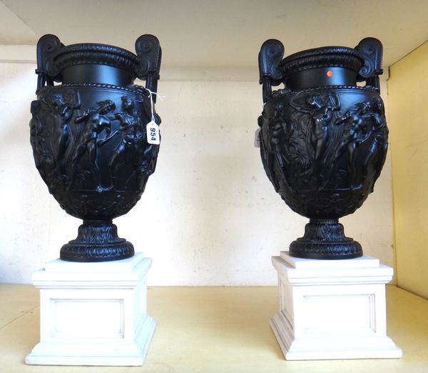 A pair of modern resin models of the Townley vases, each black painted and raised on white square plinths, 51.5cm high. (2)
