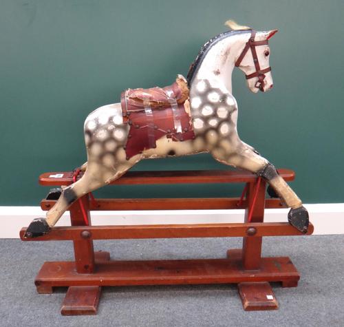 A 'Leeway' dappled grey wooden rocking horse, on a swing frame base (a.f), 85cm high.
