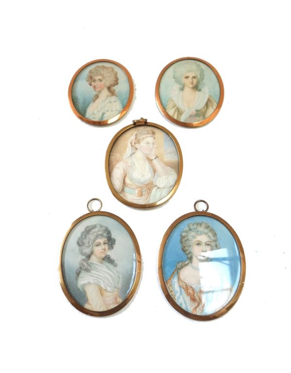 A late 19th/early 20th century Continental portrait miniature on ivory of a fashionable woman in Oriental style dress, 8cm high, and four others simil