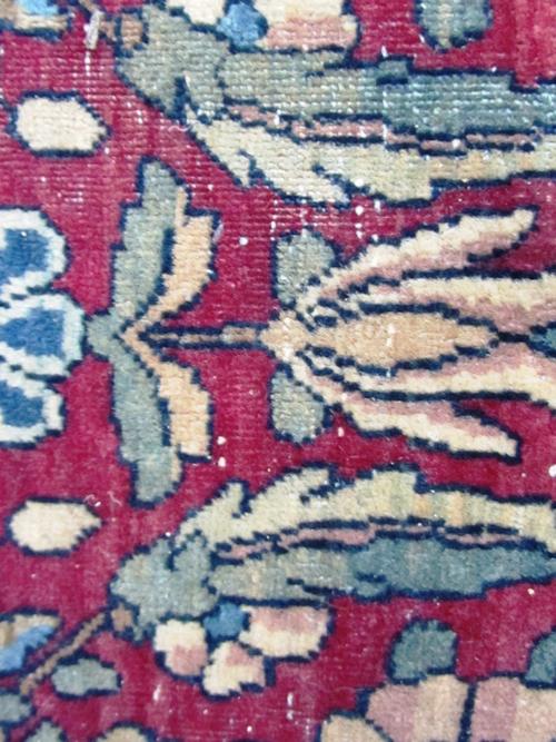 A dapple grey carved wooden rocking horse with leather tack on a swing frame base, stamped to the metal work 'L. B. Ltd S.P.2' 122cm high.