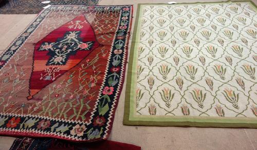 A Bessarabian kelim, the diamond with four noses, madder spandrels with vines, a black and leaf border, 216 x 135cm and a Chinese tapestry carpet, ivo