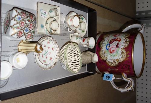 An English earthenware maroon ground loving cup, mid 19th century, painted with ruins on one side and flowers on the other, 16cm.high; also a group of