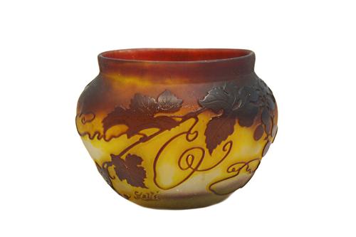 A Galle acid etched glass vase, early 20th century, decorated with grapes and vine against a purple and yellow frosted body, signed Galle, 11cm high.