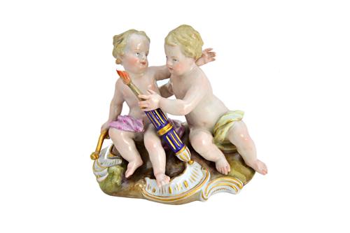 A Meissen porcelain figure group, 19th century, depicting Cupid and putto with a bow and quiver of arrows, on a gilt C scroll base, blue crossed sword