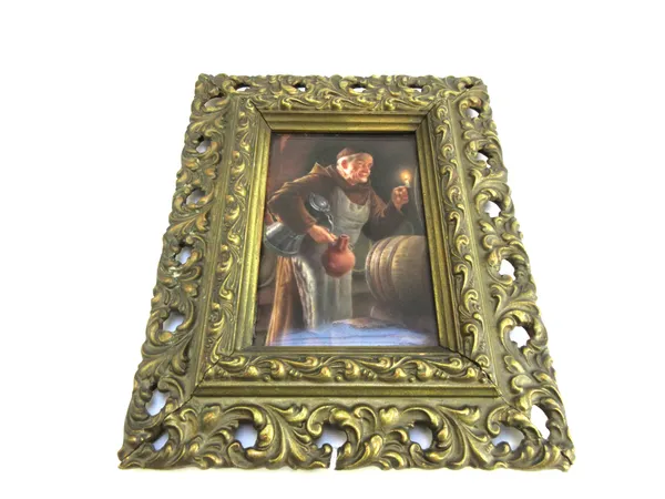 A small German rectangular porcelain plaque, early 20th century, painted with a monk in a beer cellar, holding a candlestick, flask and lidded jug, in