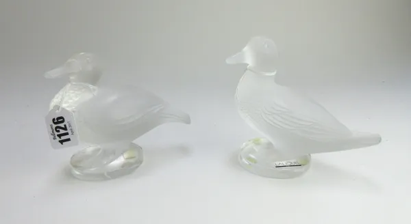 A Lalique frosted glass duck, late 20th century, etched 'Lalique France' to the circular base, 12.7cm high, and one further similar Lalique glass duck