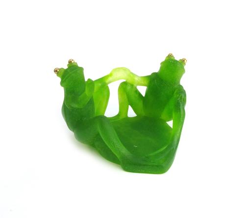 Daum; 'The frog with the golden eyes', a green glass candle holder modelled with two frogs, boxed, a Moser green glass elephant, 8cm high, a Halcyon d