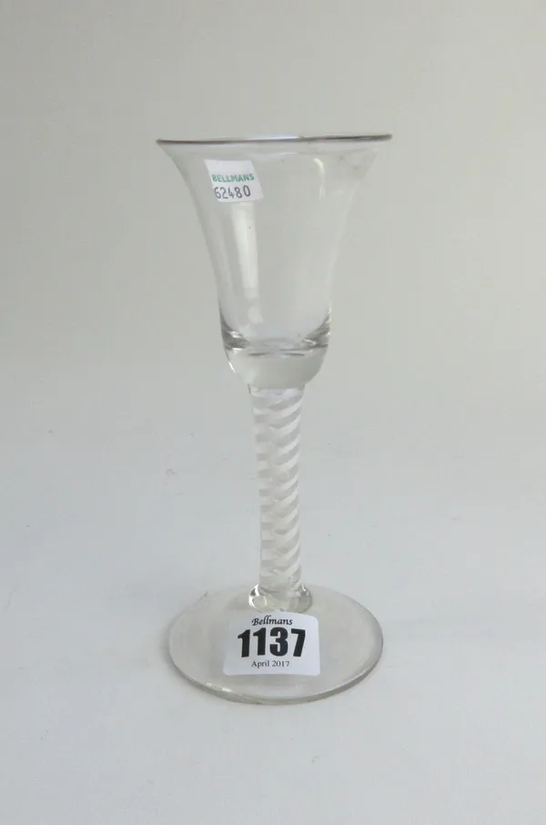An opaque twist wine glass, circa 1765, the bell bowl raised on a double series opaque twist stem and plain foot, (a.f), 17cm. high.