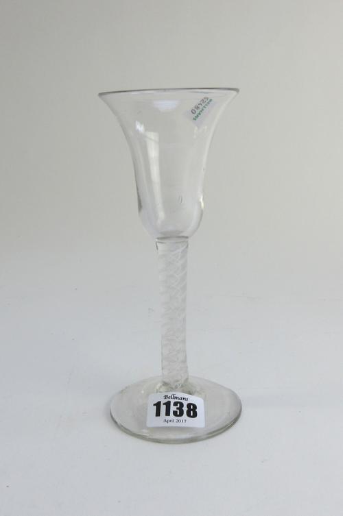 An opaque twist wine glass, circa 1765, the bell bowl raised on a double series opaque twist stem and plain foot, 17.75cm. high.