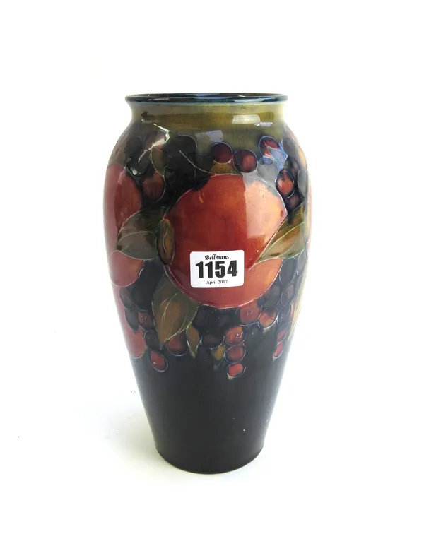 A Moorcroft 'Pomegranate' pottery vase, circa 1918, green signature and impressed marks to base, (a.f), 25.5cm high.