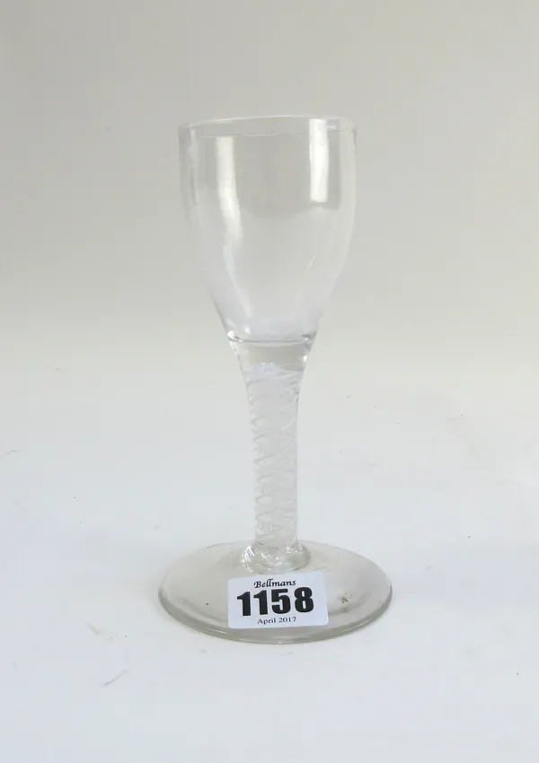 An opaque twist wine glass, circa 1765, the ogee bowl raised on a double series opaque twist stem and plain foot, 15.25cm.high.