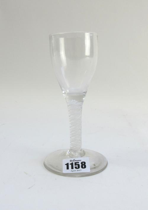An opaque twist wine glass, circa 1765, the ogee bowl raised on a double series opaque twist stem and plain foot, 15.25cm.high.
