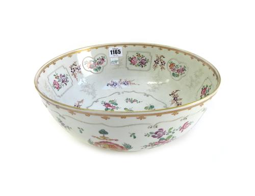 Three Samson porcelain bowls,late 19th/early 20th century, in Chinese export style,  each with foliate decoration centred by an armorial crest, 29cm d