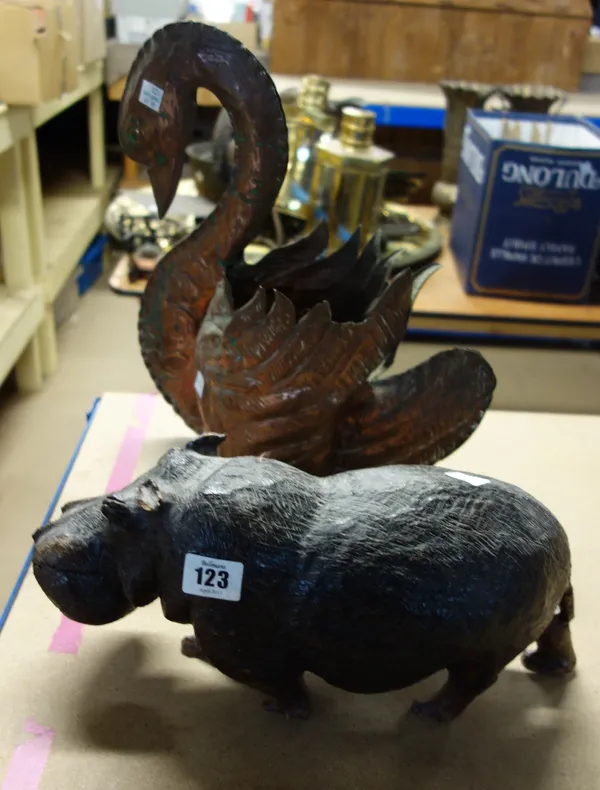 An African carved hardwood figure of a hippo and a copper jardiniere in the form of a swan, (2).   CAB