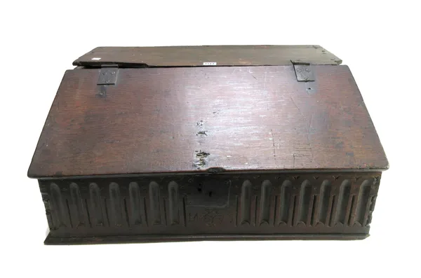 A 17th century oak slope front bible box with carved front panel, 66cm wide x 47cm deep.