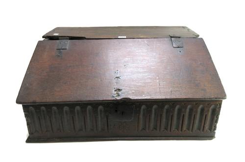 A 17th century oak slope front bible box with carved front panel, 66cm wide x 47cm deep.
