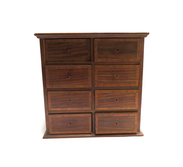 An early 20th century satinwood banded mahogany miniature chest of eight short drawers, 33cm wide x 23cm deep.