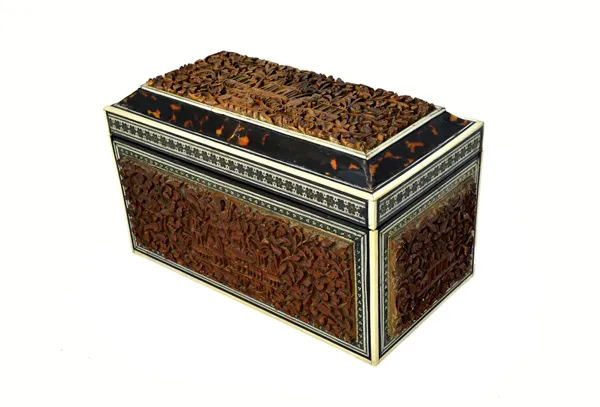 An early 19th century tortoiseshell and ivory banded Anglo-Indian carved sandalwood rectangular tea caddy, with twin lidded interior, 24cm wide x 13cm