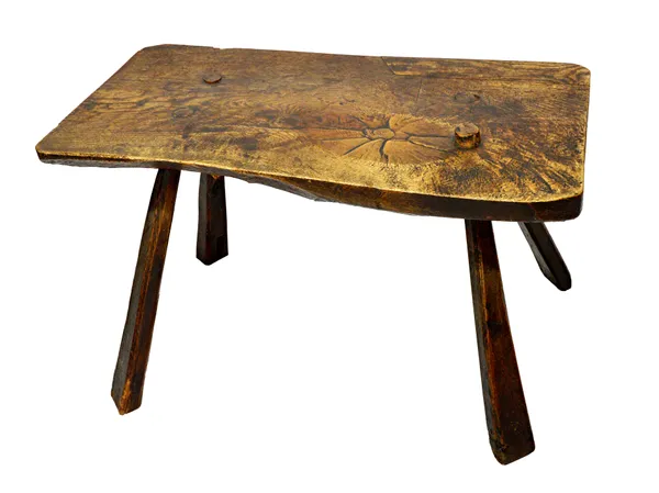 A George III oak table, the single slab rectangular oak top with chamfered underside, on four staked tapering supports, 104cm x 53cm.   Illustrated