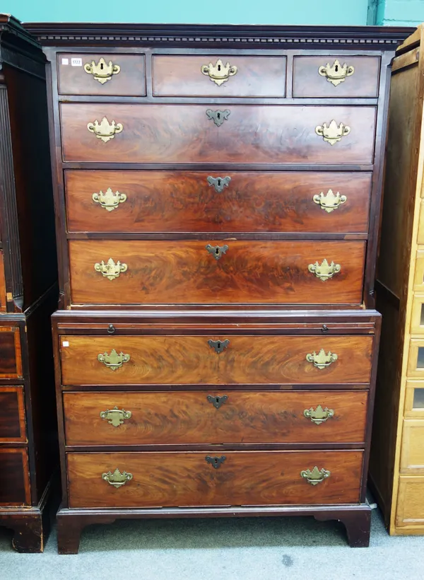 A George III mahogany chest on chest, the three short over six long graduated drawers divided by a brushing slide, on bracket feet, 120cm wide x 187cm
