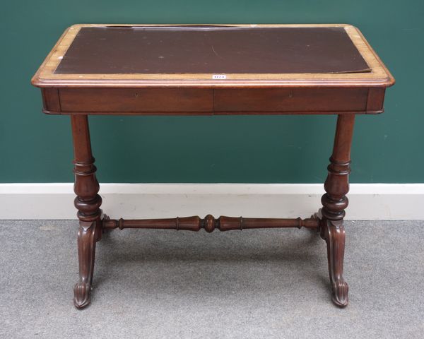 Johnstone & Jeanes, 67 New Bond Street, London, 68391; a mid-Victorian mahogany two drawer writing table on turned supports, 88cm wide x 49 cm deep.