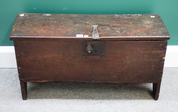 A small 17th century oak five plank coffer on slab end supports, 76cm wide x 29cm deep.