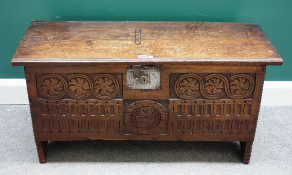 A 17th century oak five plank coffer with carved front panel, 101cm wide x 40cm deep.