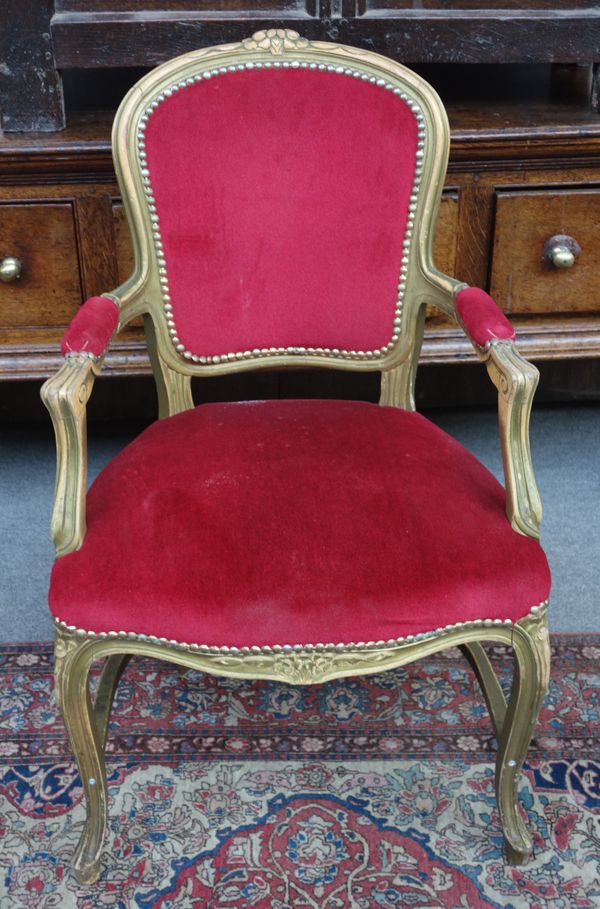 Peter Stringfellow's, Angels Club; a set of eight Louis XV style beech frame open armchairs with red upholstery, each 60cm wide x 97cm high. Sold with