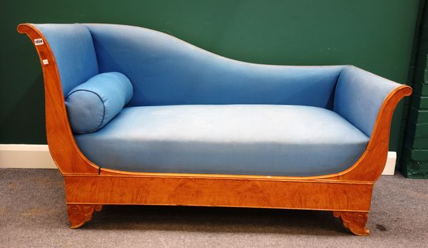 An Empire style bleached walnut drop-end chaise longue, on carved feet, 158cm wide x 88cm high.