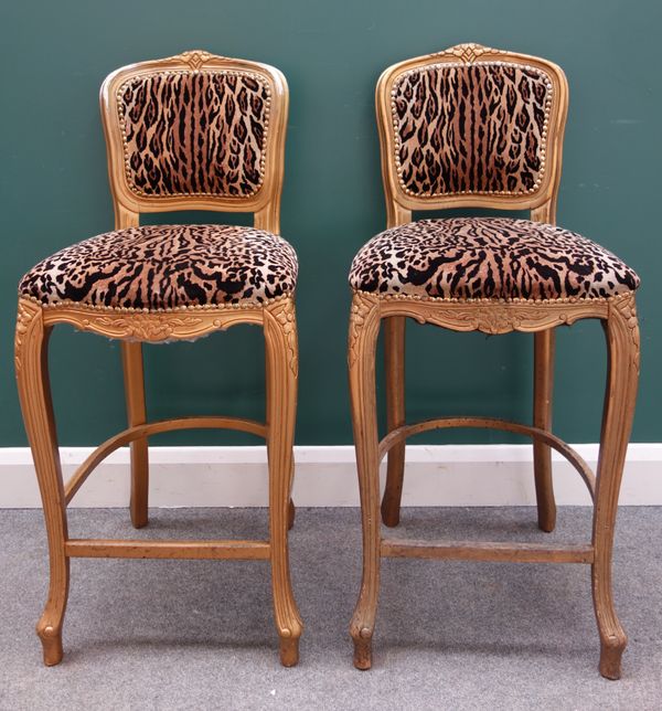 Peter Stringfellow's, Angels Club; a pair of leopard print upholstered bar stools with gold painted frames, each 47cm wide x 106cm high.  Sold with au