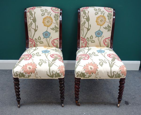 A pair of 19th century rosewood framed scroll back side chairs on barleytwist supports, each 50cm wide x 90cm high (2).