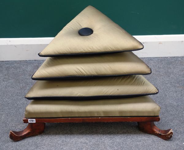 A 20th century triangular 'Aladdin' footstool, on a gilt slipper carved base, 60cm wide x 55cm high.