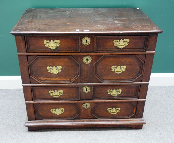 A Charles II oak chest of four long geometric drawers, 96cm wide x 58cm deep.