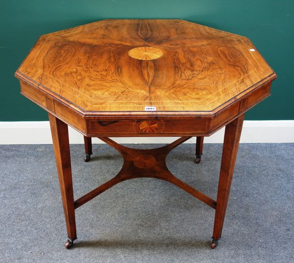 An Edwardian marquetry inlaid rosewood octagonal centre table, on tapering square supports and shaped stretcher, 91cm wide x 74cm high.