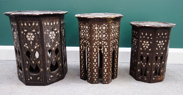 A late 19th century Syrian hardwood, bone and mother-of-pearl inlaid octagonal occasional table, 43cm wide x 50cm high, and four others similar (5).