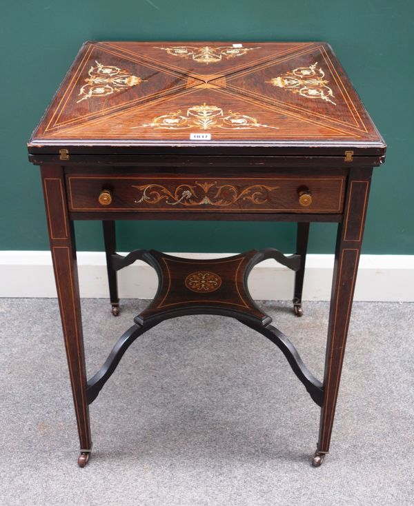 An Edwardian bone and marquetry inlaid envelope card table, on tapering square supports, 56cm wide x 75cm high.