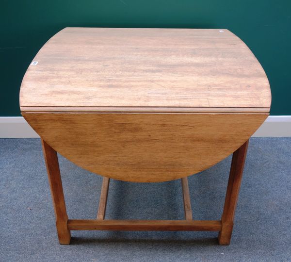 James Shoolbred; a late 19th century oak dropleaf breakfast table, white ivorine maker's disc, with oval top on chamfered supports and similar stretch