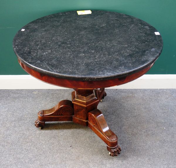 An early 19th century French gueridon, with circular marble top on hexagonal baluster supports and three paw feet, 83cm wide x 73cm high.