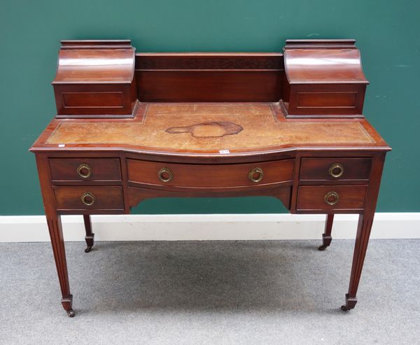 A late 19th/early 20th century mahogany Carlton House style desk on tapering square supports, 123cm wide x 57cm deep.