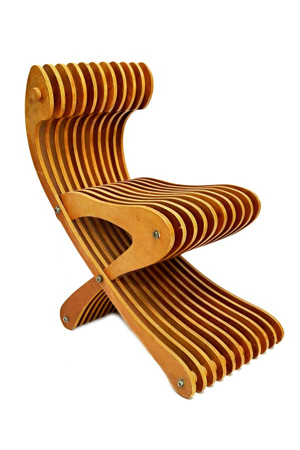 A 20th century laminated plywood chair (possibly a prototype), of 'X' frame form, 36cm wide x 75cm high.  Illustrated