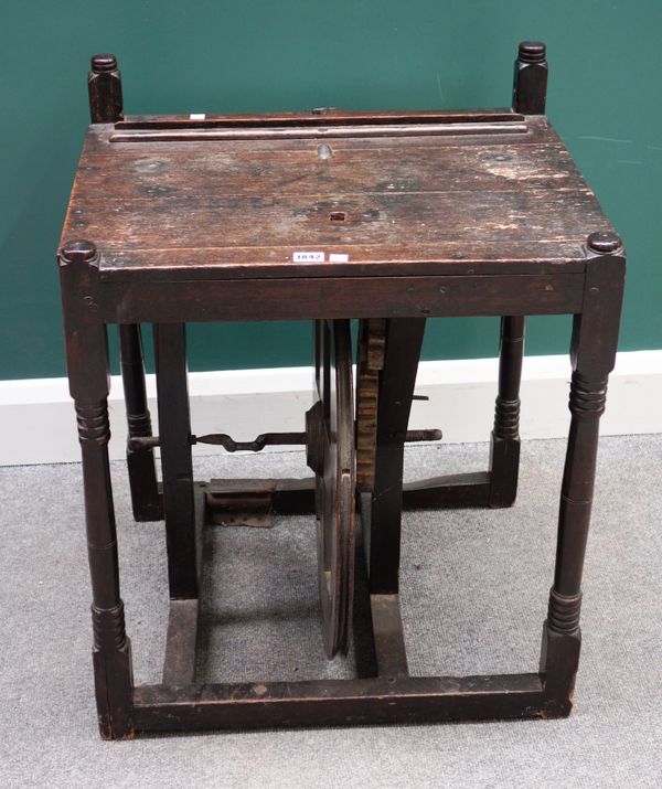 An 18th century oak framed treadle table, possible for wool winding, 60cm wide x 50cm deep.