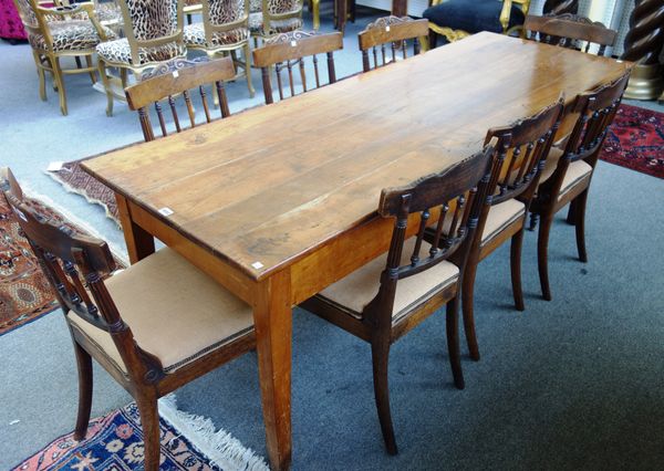 A late 18th century French cherry farm house kitchen table, on tapering square supports, 72cm wide x 200cm long.