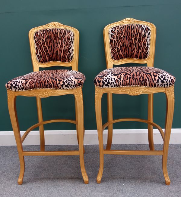 Peter Stringfellow's, Angels Club; a pair of leopard print upholstered bar stool with gold painted frames, each 52cm wide x 114cm high. Sold with auth