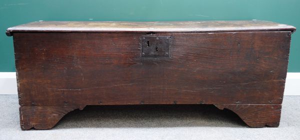 A 17th century oak five plank coffer, with slab end supports with chip work decoration, 131cm wide x 36cm deep.