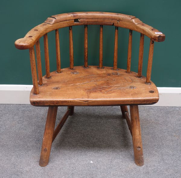 A George III West Country stick back chair, with three piece rail and solid seat on staked supports, 63cm wide x 65cm high.